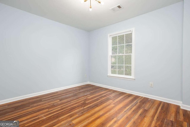1533 Fallen Leaf Dr SW, Marietta, GA 30064 - unfurnished room with dark wood finished floors, visible vents, and baseboards