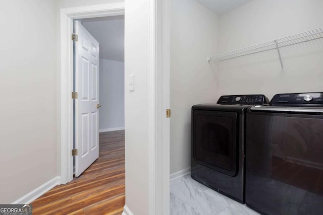 1533 Fallen Leaf Dr SW, Marietta, GA 30064 - clothes washing area with baseboards and separate washer and dryer