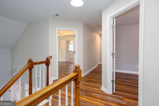 1533 Fallen Leaf Dr SW, Marietta, GA 30064 - corridor featuring wood finished floors, visible vents, baseboards, and an upstairs landing