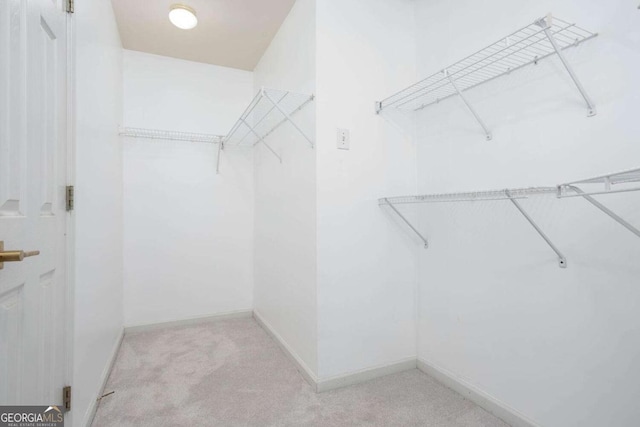 1533 Fallen Leaf Dr SW, Marietta, GA 30064 - walk in closet featuring carpet floors