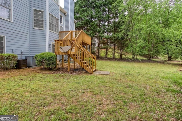 1533 Fallen Leaf Dr SW, Marietta, GA 30064 - view of yard featuring a wooden deck, central air condition unit, and stairs