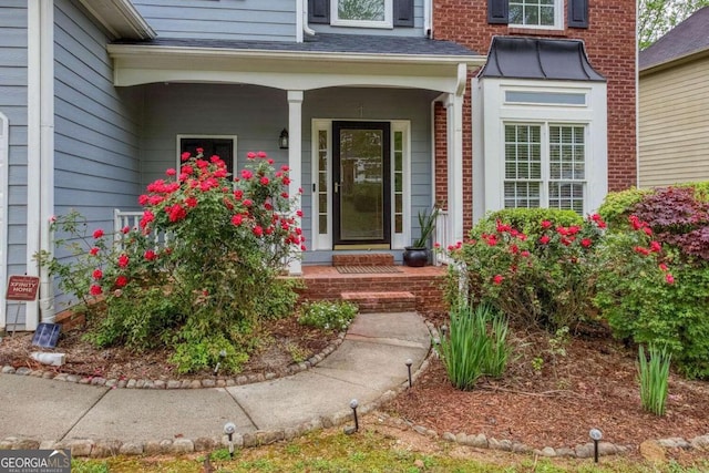 1533 Fallen Leaf Dr SW, Marietta, GA 30064 - view of exterior entry featuring brick siding and a porch