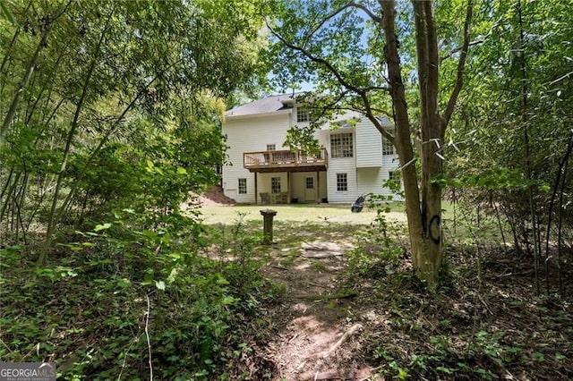 rear view of house with a wooden deck