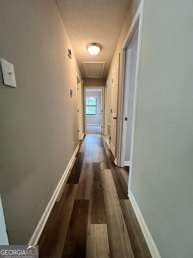 2045 Greentree Pkwy, Macon, GA 31220 - corridor with baseboards, a textured ceiling, and dark wood-style floors