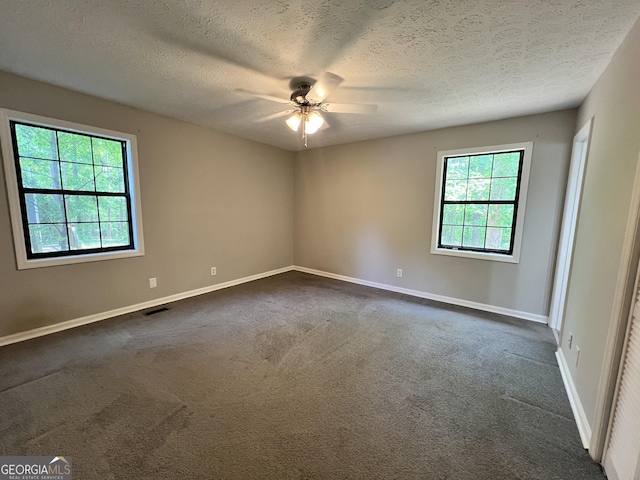 2045 Greentree Pkwy, Macon, GA 31220 - spare room featuring dark colored carpet, ceiling fan, visible vents, and baseboards