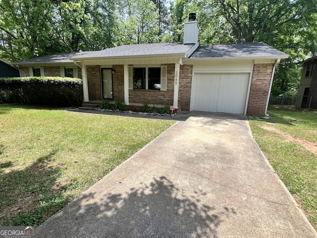 2045 Greentree Pkwy, Macon, GA 31220 - ranch-style home with a garage, a front lawn, a chimney, and concrete driveway