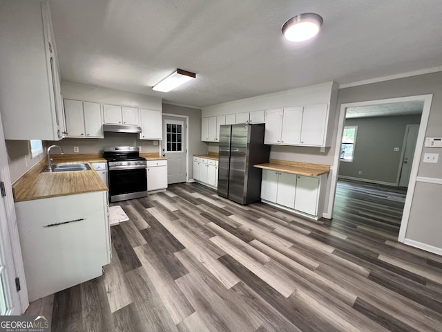 2045 Greentree Pkwy, Macon, GA 31220 - kitchen featuring under cabinet range hood, a sink, wooden counters, and appliances with stainless steel finishes