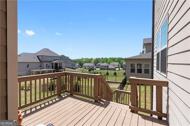wooden terrace featuring a residential view
