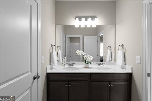 bathroom with double vanity and a sink