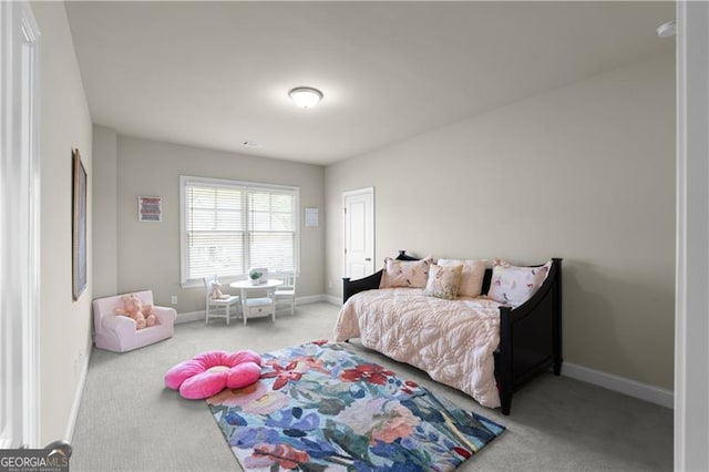 bedroom featuring carpet floors and baseboards