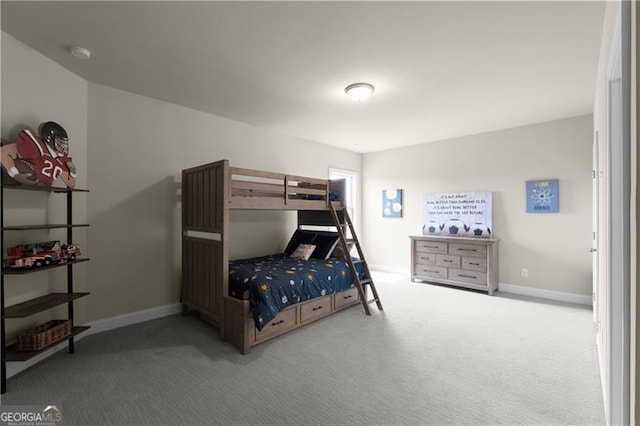 bedroom with baseboards and carpet flooring