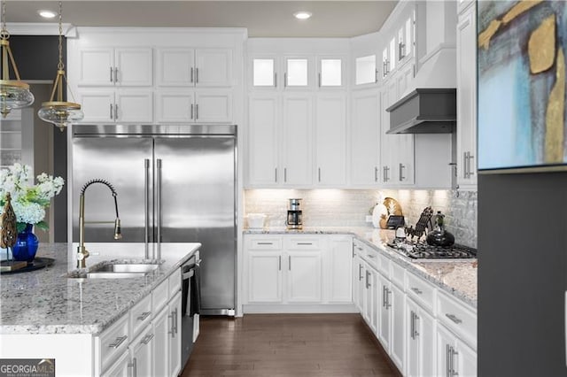 kitchen with white cabinets, stainless steel appliances, and a sink