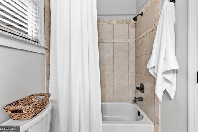 1985 Chapel Estates Ln, Dacula, GA 30019 - bathroom with shower / bathtub combination with curtain and toilet