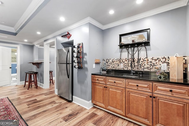 1985 Chapel Estates Ln, Dacula, GA 30019 - kitchen featuring freestanding refrigerator, crown molding, light wood finished floors, backsplash, and recessed lighting