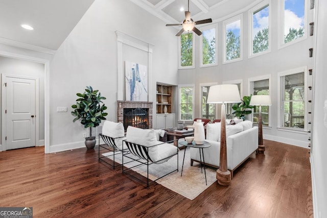 1985 Chapel Estates Ln, Dacula, GA 30019 - living area featuring a fireplace, healthy amount of natural light, a ceiling fan, wood finished floors, and recessed lighting