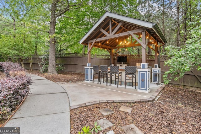 1985 Chapel Estates Ln, Dacula, GA 30019 - view of property's community with a gazebo, a fenced backyard, and a patio area