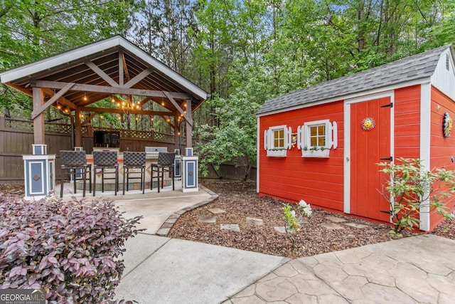 1985 Chapel Estates Ln, Dacula, GA 30019 - view of shed featuring a fenced backyard and a gazebo