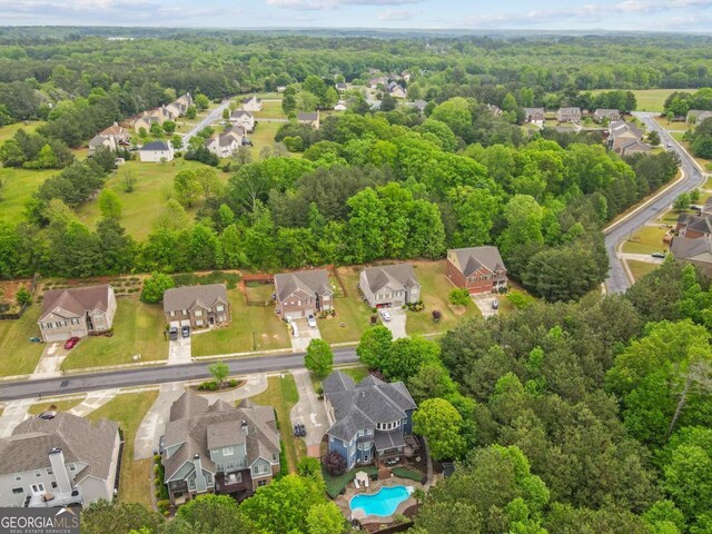 1985 Chapel Estates Ln, Dacula, GA 30019 - aerial view of residential area with a forest and a pool
