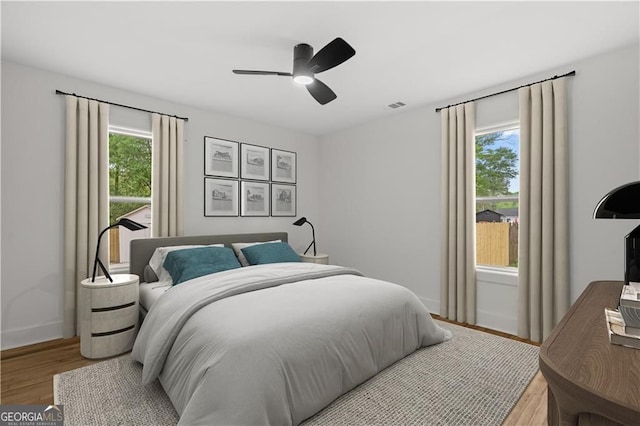 1835 Hawkins St, Smyrna, GA 30080 - bedroom with wood finished floors, visible vents, a ceiling fan, and baseboards