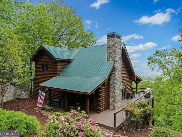 399 Ranch Mountain Dr, Dahlonega, GA 30533 - exterior space featuring log exterior, a wooden deck, a chimney, and metal roof