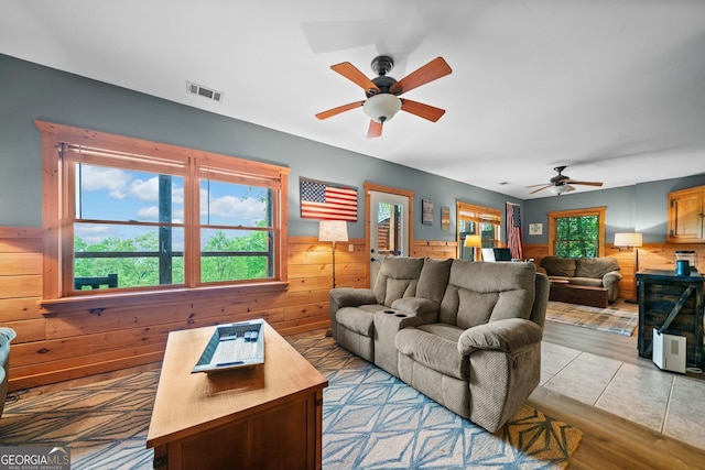 399 Ranch Mountain Dr, Dahlonega, GA 30533 - living room featuring wooden walls, a wainscoted wall, ceiling fan, and visible vents