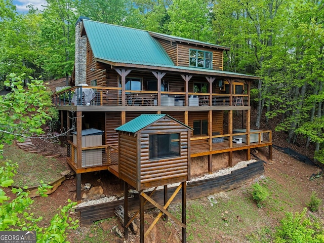 399 Ranch Mountain Dr, Dahlonega, GA 30533 - rear view of house featuring log exterior, a deck, and metal roof