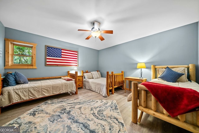 399 Ranch Mountain Dr, Dahlonega, GA 30533 - bedroom featuring ceiling fan and wood finished floors