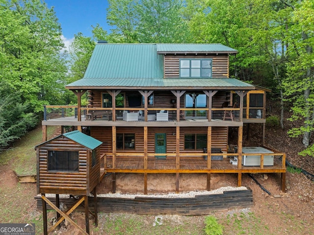 399 Ranch Mountain Dr, Dahlonega, GA 30533 - back of property featuring metal roof and a balcony