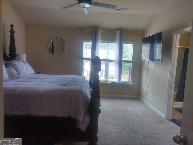 carpeted bedroom with baseboards, ceiling fan, lofted ceiling, and visible vents
