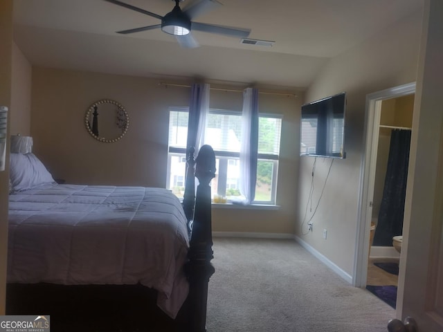 carpeted bedroom with baseboards, ceiling fan, vaulted ceiling, and visible vents