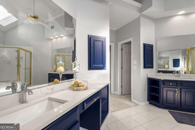 500 Meadowmeade Ln, Lawrenceville, GA 30043 - bathroom featuring a shower stall, two vanities, a ceiling fan, ornamental molding, and tile patterned flooring
