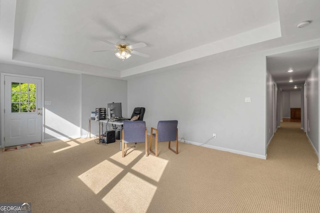 500 Meadowmeade Ln, Lawrenceville, GA 30043 - sitting room with a tray ceiling, carpet floors, a ceiling fan, and a desk