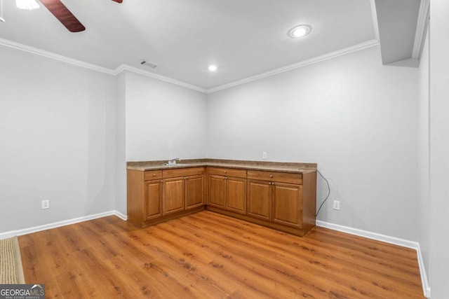 500 Meadowmeade Ln, Lawrenceville, GA 30043 - unfurnished room with light wood-style floors, a ceiling fan, crown molding, and recessed lighting