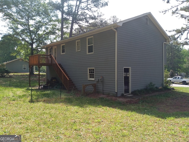 4616 Hamlet Walk SE, Conyers, GA 30094 - back of house featuring stairs, a deck, and a yard