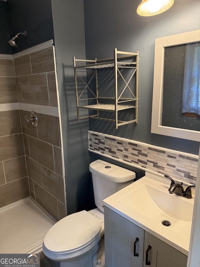 4616 Hamlet Walk SE, Conyers, GA 30094 - bathroom with a stall shower, vanity, decorative backsplash, and toilet