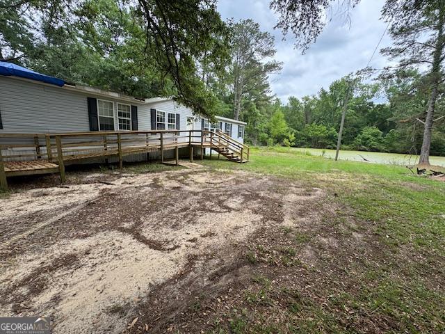 view of yard featuring a deck