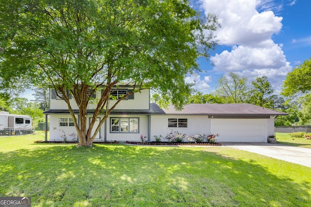 203 N Lake Dr, Brunswick, GA 31525 - traditional home with an attached garage, driveway, fence, and a front yard