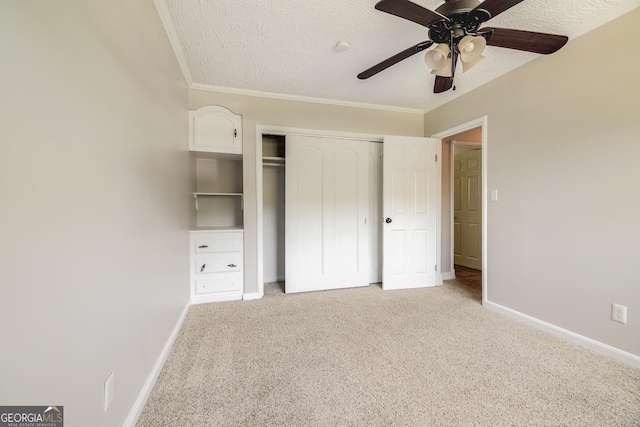 203 N Lake Dr, Brunswick, GA 31525 - unfurnished bedroom featuring baseboards, crown molding, light carpet, and a closet