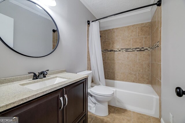 203 N Lake Dr, Brunswick, GA 31525 - full bath featuring vanity, a textured ceiling, toilet, tile patterned flooring, and shower / bath combination with curtain