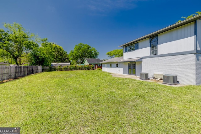 203 N Lake Dr, Brunswick, GA 31525 - view of yard with central AC unit and fence