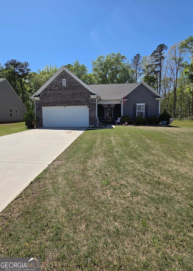 288 Mccall Way, Monroe, GA 30655 - ranch-style house featuring brick siding, an attached garage, a front yard, and driveway