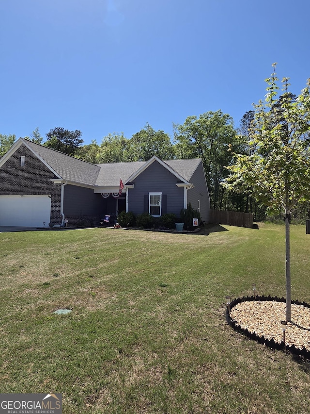 288 Mccall Way, Monroe, GA 30655 - ranch-style home with an attached garage and a front yard