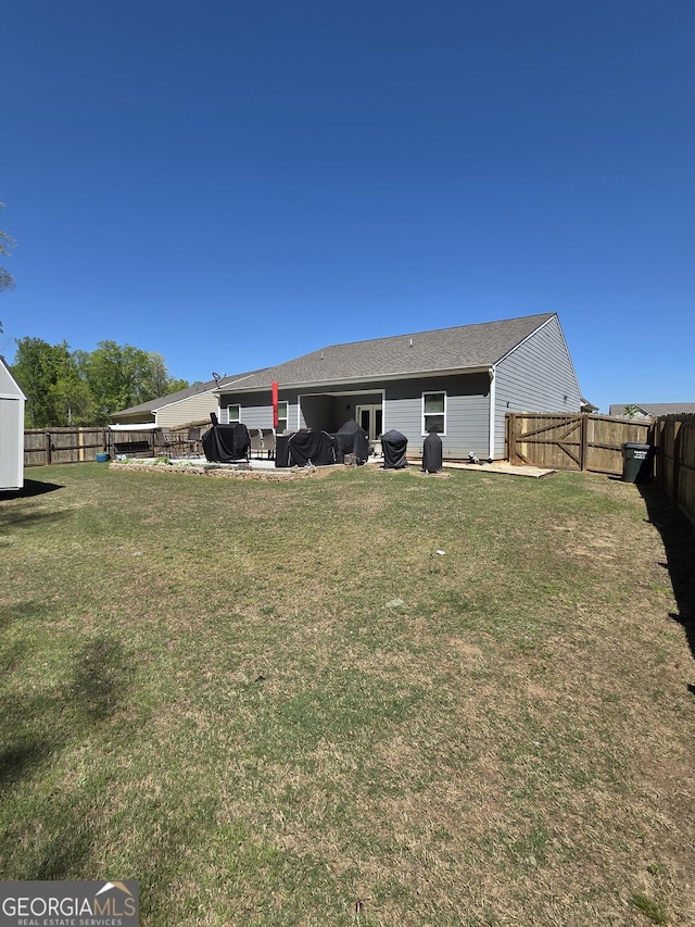 288 Mccall Way, Monroe, GA 30655 - back of property featuring a lawn and a fenced backyard