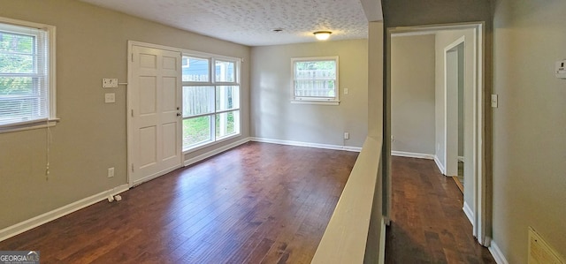 185 Johnson Dr, Athens, GA 30605 - entrance foyer with dark wood-style floors and a textured ceiling