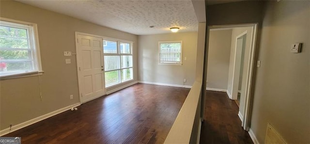 185 Johnson Dr, Athens, GA 30605 - foyer entrance with dark wood-style flooring and a textured ceiling