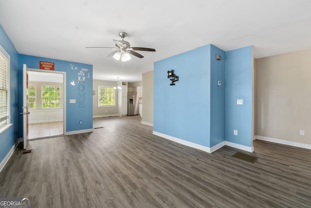 1825 SW Willis Mill Rd, Atlanta, GA 30311 - unfurnished living room featuring a ceiling fan, baseboards, and dark wood finished floors