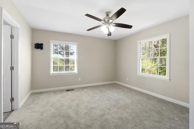1825 SW Willis Mill Rd, Atlanta, GA 30311 - carpeted empty room with plenty of natural light, visible vents, baseboards, and ceiling fan