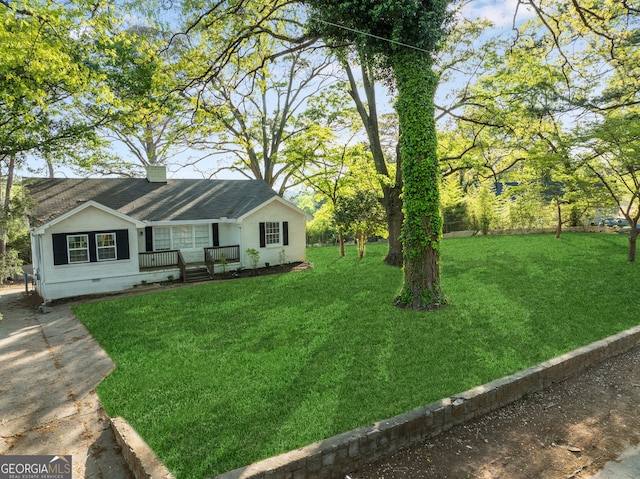 1825 SW Willis Mill Rd, Atlanta, GA 30311 - exterior space with a front lawn, crawl space, a shingled roof, covered porch, and a chimney