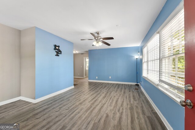 1825 SW Willis Mill Rd, Atlanta, GA 30311 - unfurnished room with baseboards, a ceiling fan, wood finished floors, and a wealth of natural light