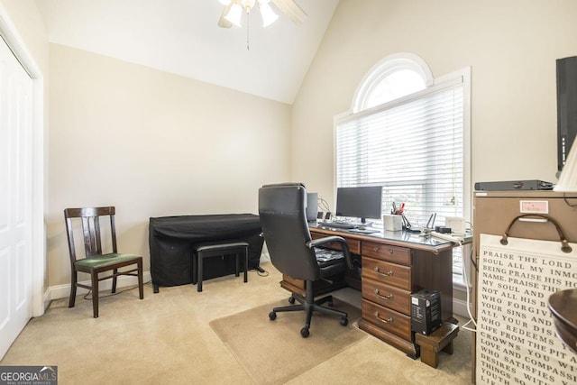home office with carpet flooring, high vaulted ceiling, and a ceiling fan